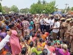 Villagers block a road to protest after five people died after allegedly consuming spurious liquor, in Viluppuram district,