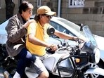 Amitabh Bachchan and Anushka Sharma were seen riding bikes without helmets. Amitabh Bachchan and Anushka Sharma were seen riding bikes without helmets.