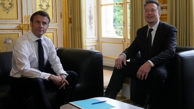 Tesla CEO Elon Musk, right, poses with French President Emmanuel Macron prior to their talks. (AP) Tesla CEO Elon Musk, right, poses with French President Emmanuel Macron prior to their talks. (AP)