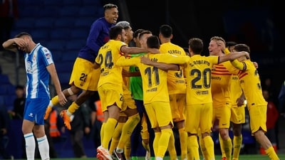 Barcelona players celebrate after the Spanish La Liga soccer match between Espanyol and Barcelona (AP) Barcelona players celebrate after the Spanish La Liga soccer match between Espanyol and Barcelona (AP)