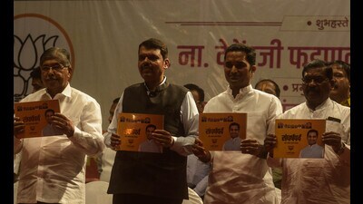 Devendra Fadnavis (2nd from left) at a function at Annabhau Sathe Kalamandir on Monday. (Shankar Narayan/HT PHOTO) Devendra Fadnavis (2nd from left) at a function at Annabhau Sathe Kalamandir on Monday. (Shankar Narayan/HT PHOTO)