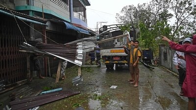 Local residents check the damages after Cyclone Mocha's crashed ashore, in Kyauktaw in Myanmar's Rakhine state on May 14, 2023. (AFP) Local residents check the damages after Cyclone Mocha's crashed ashore, in Kyauktaw in Myanmar's Rakhine state on May 14, 2023. (AFP)