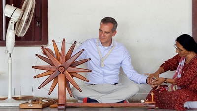 Ambassador of United States to India Eric Garcetti spins the charkha during his visit to the Sabarmati Gandhi Ashram. (PTI) Ambassador of United States to India Eric Garcetti spins the charkha during his visit to the Sabarmati Gandhi Ashram. (PTI)