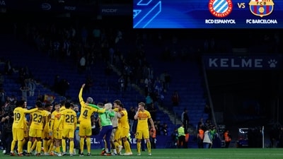 Barca players celebrate after the Spanish La Liga match between Espanyol and Barcelona (AP) Barca players celebrate after the Spanish La Liga match between Espanyol and Barcelona (AP)