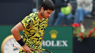 Spain's Carlos Alcaraz reacts after losing his third round match of the Men's ATP Rome Open tennis tournament to Hungary's Fabian Marozsan (AFP) Spain's Carlos Alcaraz reacts after losing his third round match of the Men's ATP Rome Open tennis tournament to Hungary's Fabian Marozsan (AFP)