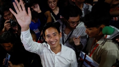 Move Forward Party leader and prime ministerial candidate, Pita Limjaroenrat, waves to the crowd during the general election in Bangkok, Thailand. (REUTERS)
