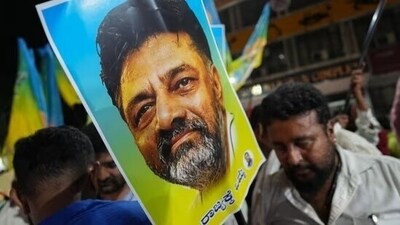 Supporters of senior Congress leader DK Shivakumar outside the venue of the Congress Legislature Party (CLP) meeting in Bengaluru on Sunday. (PTI)