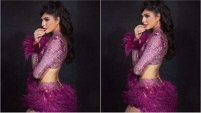 Jacqueline Fernandez accessorised her purple look with stylish crisscross-patterned white stockings and added a touch of glamour with purple crystals on her cheeks. (Instagram/@jacquelinef143) Jacqueline Fernandez accessorised her purple look with stylish crisscross-patterned white stockings and added a touch of glamour with purple crystals on her cheeks. (Instagram/@jacquelinef143)