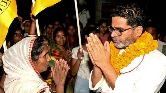 Election strategist Prashant Kishor greets an elderly woman during the 'Jan Suraj Padayatra', in Vaishalii. (ANI File Photo)