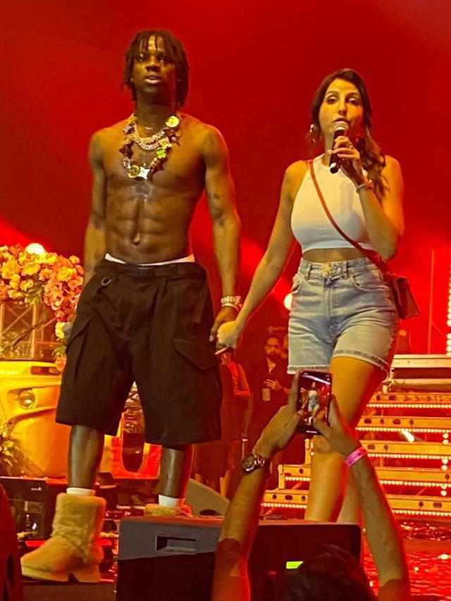 Rema with Nora Fatehi on stage Rema with Nora Fatehi on stage