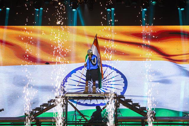 Nigerian singer Rema aka Divine Ikubor opens the show with a Tricolour in hand Nigerian singer Rema aka Divine Ikubor opens the show with a Tricolour in hand