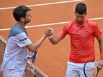 Britain's Cameron Norrie (L) and Serbia's Novak Djokovic shake hands after Djokovic won their fourth round match Britain's Cameron Norrie (L) and Serbia's Novak Djokovic shake hands after Djokovic won their fourth round match