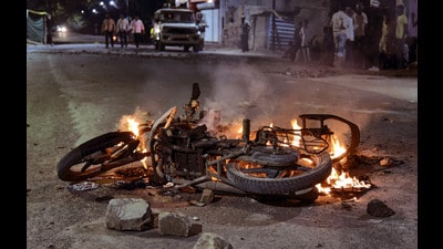 A vehicle set on fire by miscreants during clashes between members of two communities over a social media post, in Akola, Maharashtra. (PTI) A vehicle set on fire by miscreants during clashes between members of two communities over a social media post, in Akola, Maharashtra. (PTI)