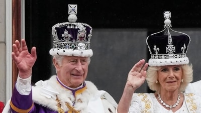 Britain's King Charles III and Queen Camilla wave to the crowds from the balcony of Buckingham Palace after the coronation ceremony in London. (AP) Britain's King Charles III and Queen Camilla wave to the crowds from the balcony of Buckingham Palace after the coronation ceremony in London. (AP)