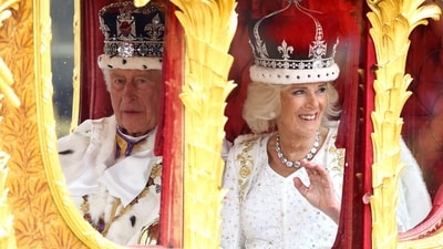 Britain's King Charles and Queen Camilla travel from Westminster Abbey in the Gold State Coach, following their coronation ceremony, in London, Britain. (Reuters)