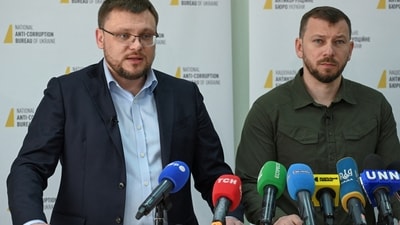 Director of the National Anti-Corruption Bureau Semen Kryvonos and Director of the Specialized Anti-Corruption Prosecutor's Office Oleksandr Klymenko attend a press conference dedicated to the detention of Ukraine's Supreme Court head. (Reuters)