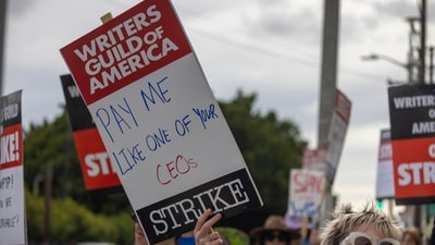 People picket outside of Paramount Pictures studios during the Hollywood writers strike on May 4, 2023 in Los Angeles. (Getty Images via AFP) People picket outside of Paramount Pictures studios during the Hollywood writers strike on May 4, 2023 in Los Angeles. (Getty Images via AFP)