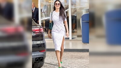 Esha Gupta wore a white slit shimmery dress which she paired with green open-toe heels and a handbag. (Instagram/@egupta) Esha Gupta wore a white slit shimmery dress which she paired with green open-toe heels and a handbag. (Instagram/@egupta)