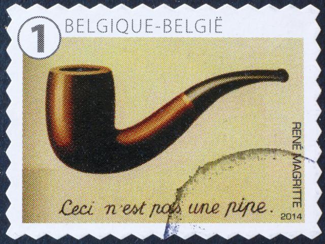 A stamp featuring Magritte’s ‘This is Not a Pipe’. (spatuletail /Shutterstock) A stamp featuring Magritte’s ‘This is Not a Pipe’. (spatuletail /Shutterstock)