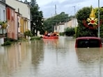 Rescuers take people to safety during rescue operations, in Forli, Italy after floods hit Italy's northern Emilia-Romagna region.