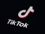 The icon for the video sharing TikTok app is seen on a smartphone. The icon for the video sharing TikTok app is seen on a smartphone.