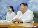 North Korean leader Kim Jong Un and his daughter Kim Ju Ae meet with members of the Non-permanent Satellite Launch Preparatory Committee.