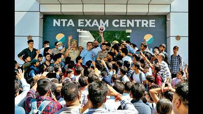 Aspirants outside a CUET centre in August last year. (File photo) Aspirants outside a CUET centre in August last year. (File photo)