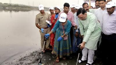 Delhi environment minister Gopal Rai participates in the clean-up of the Yamuna during the launch of the campaign near ITO, in New Delhi on Wednesday. (ANI) Delhi environment minister Gopal Rai participates in the clean-up of the Yamuna during the launch of the campaign near ITO, in New Delhi on Wednesday. (ANI)