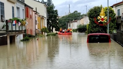Rescuers take people to safety during rescue operations, in Forli, Italy after floods hit Italy's northern Emilia-Romagna region. (via REUTERS)