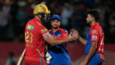 Delhi Capitals' Kuldeep Yadav, center, consoles Punjab Kings' Liam Livingstone, left, at the end of the Indian Premier League cricket match between Punjab Kings and Delhi Capitals (AP) Delhi Capitals' Kuldeep Yadav, center, consoles Punjab Kings' Liam Livingstone, left, at the end of the Indian Premier League cricket match between Punjab Kings and Delhi Capitals (AP)