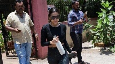 Malaika Arora was spotted at Diva Yoga in Bandra, Mumbai. She was dressed in a black top and tights. Malaika Arora was spotted at Diva Yoga in Bandra, Mumbai. She was dressed in a black top and tights.