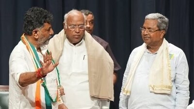 Karnataka's two chief ministerial aspirants Siddaramaiah and D K Shivakumar held separate meetings with Congress president Mallikarjun Kharge on Tuesday. (File) Karnataka's two chief ministerial aspirants Siddaramaiah and D K Shivakumar held separate meetings with Congress president Mallikarjun Kharge on Tuesday. (File)