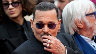 Johnny Depp poses for photographers upon arrival at the opening ceremony and the premiere of the film Jeanne du Barry. (Scott Garfitt/Invision/AP) Johnny Depp poses for photographers upon arrival at the opening ceremony and the premiere of the film Jeanne du Barry. (Scott Garfitt/Invision/AP)