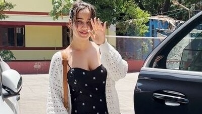 Neha Sharma was seen outside a gym in Bandra. She wore a black and white dress under a cream-coloured shrug. 