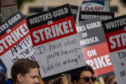 LOS ANGELES, CA - MAY 04: People picket outside of Paramount Pictures studios during the Hollywood writers strike on May 4, 2023 in Los Angeles, California. Scripted TV series, late-night talk shows, film and streaming productions are being interrupted by the Writers Guild of America (WGA) strike. (Getty Images via AFP) LOS ANGELES, CA - MAY 04: People picket outside of Paramount Pictures studios during the Hollywood writers strike on May 4, 2023 in Los Angeles, California. Scripted TV series, late-night talk shows, film and streaming productions are being interrupted by the Writers Guild of America (WGA) strike. (Getty Images via AFP)