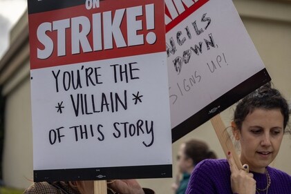 People picket outside of Paramount Pictures studios during the Hollywood writers strike on May 4, 2023 in Los Angeles, California. Scripted TV series, late-night talk shows, film and streaming productions are being interrupted by the Writers Guild of America (WGA) strike. (Getty Images via AFP) People picket outside of Paramount Pictures studios during the Hollywood writers strike on May 4, 2023 in Los Angeles, California. Scripted TV series, late-night talk shows, film and streaming productions are being interrupted by the Writers Guild of America (WGA) strike. (Getty Images via AFP)