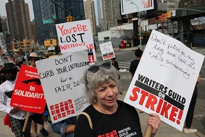 Writers Guild of America (WGA) East members walk a picket line at the Disney Upfront event at the Javits Center on May 16, 2023 in New York City. Teachers Union President Randi Weingarten joined members of the WGA East as they held its recent picket line at an event for New York . (Getty Images via AFP) Writers Guild of America (WGA) East members walk a picket line at the Disney Upfront event at the Javits Center on May 16, 2023 in New York City. Teachers Union President Randi Weingarten joined members of the WGA East as they held its recent picket line at an event for New York . (Getty Images via AFP)