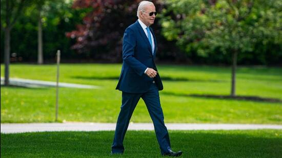 US President Joe Biden walks on the South Lawn of the White House before boarding Marine One in Washington, DC, US, on Wednesday. (Bloomberg)