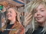 The image shows the Australia tourist getting a 'Cosmic head massage' from a Indian barber. 
