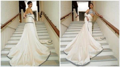 Sara Ali Khan takes us back in time as she gives a tribute to old-school Bollywood fashion in a white and black modern saree. (Instagram/@saraalikhan95) Sara Ali Khan takes us back in time as she gives a tribute to old-school Bollywood fashion in a white and black modern saree. (Instagram/@saraalikhan95)