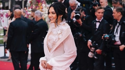 Esha Gupta walked the red carpet in a stunning gown at Cannes on Tuesday. She wore a white dress with high slit. Esha Gupta walked the red carpet in a stunning gown at Cannes on Tuesday. She wore a white dress with high slit. 