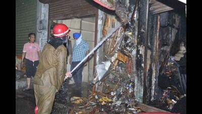 Firefighters trying to douse the flames at Decades old dupatta store Ludhiana on Wednesday. (Manish/HT) Firefighters trying to douse the flames at Decades old dupatta store Ludhiana on Wednesday. (Manish/HT)