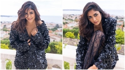 Mrunal's black bodysuit features spaghetti straps, a plunging sweetheart neckline, structured boning on the cups, a backless detail, and high-leg cut-outs. She styled it with black pants adorned with intricate lace embroidery, a see-through silhouette, fitted and flare design, and floor-grazing hem length. (Instagram) Mrunal's black bodysuit features spaghetti straps, a plunging sweetheart neckline, structured boning on the cups, a backless detail, and high-leg cut-outs. She styled it with black pants adorned with intricate lace embroidery, a see-through silhouette, fitted and flare design, and floor-grazing hem length. (Instagram)