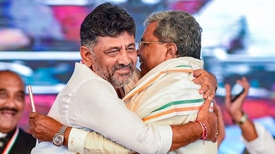 Karnataka Congress President DK Shivakumar hugs former Karnataka CM and Siddaramaiah in Davangere. (PTI Photo/Shailendra Bhojak) Karnataka Congress President DK Shivakumar hugs former Karnataka CM and Siddaramaiah in Davangere. (PTI Photo/Shailendra Bhojak)