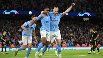 Manchester City's Swiss defender Manuel Akanji (L) celebrates scoring the team's third goal with Manchester City's Norwegian striker Erling Haaland during the UEFA Champions League second leg semi-final vs Real Madrid (AFP) Manchester City's Swiss defender Manuel Akanji (L) celebrates scoring the team's third goal with Manchester City's Norwegian striker Erling Haaland during the UEFA Champions League second leg semi-final vs Real Madrid (AFP)