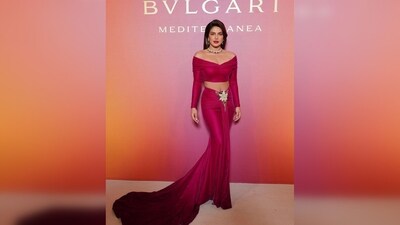For the star-studded glam night, PeeCee decked up in a red skirt set comprising an off-shoulder neckline blouse and a skirt featuring a long floor-sweeping train. (Instagram/@priyankachopra) For the star-studded glam night, PeeCee decked up in a red skirt set comprising an off-shoulder neckline blouse and a skirt featuring a long floor-sweeping train. (Instagram/@priyankachopra)