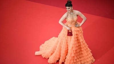Urvashi Rautela walked the red carpet at the screening of the film Kaibutsu (Monster) during the 76th edition of the Cannes Film Festival on Wednesday. For her second red carpet appearance, she wore a bright orange ruffled gown. (AFP) Urvashi Rautela walked the red carpet at the screening of the film Kaibutsu (Monster) during the 76th edition of the Cannes Film Festival on Wednesday. For her second red carpet appearance, she wore a bright orange ruffled gown. (AFP)