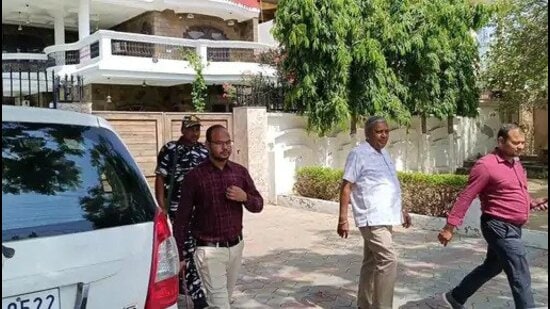 I-T officials outside Deep Malhotra’s residence in Faridkot. (HT Photo)