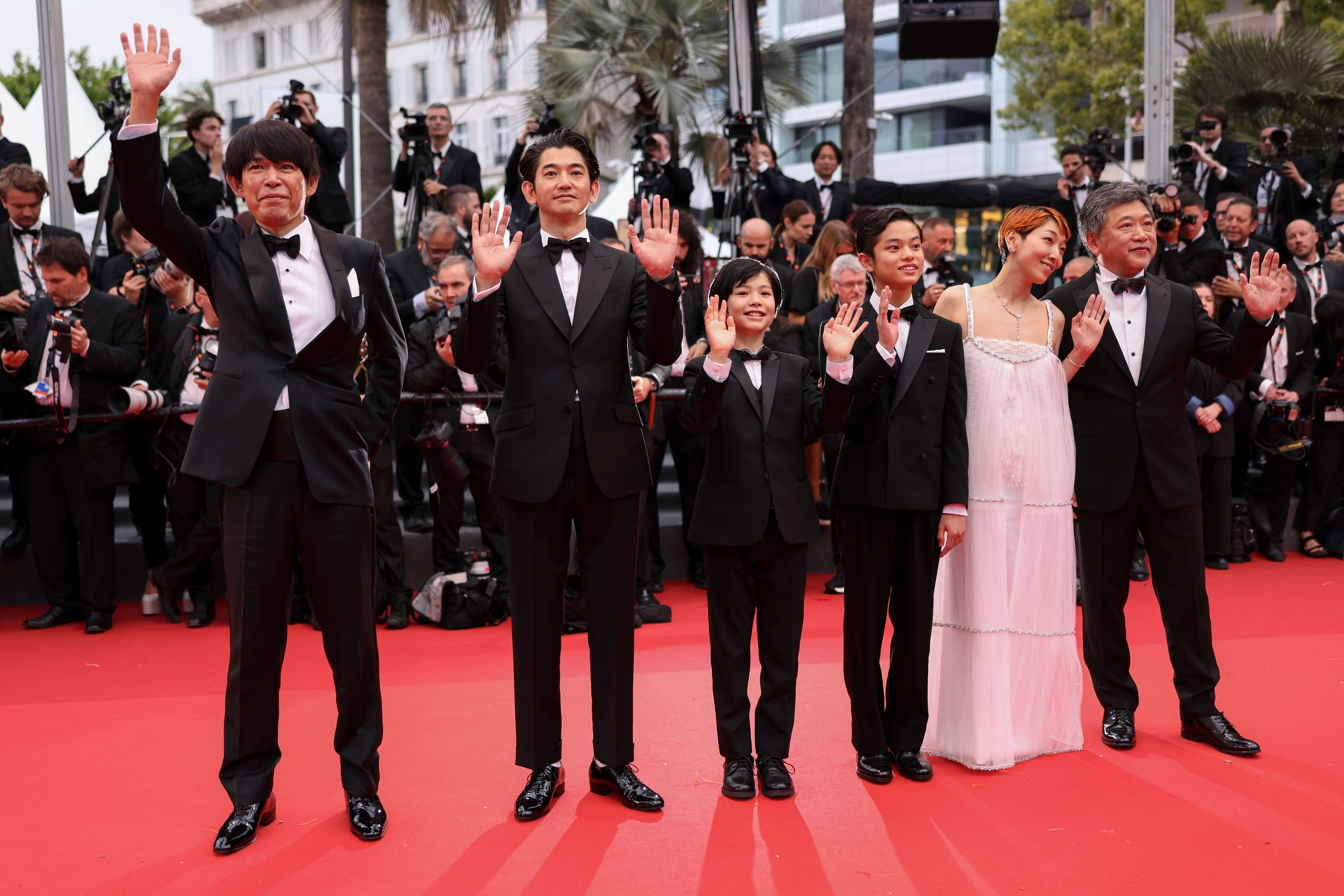 Yuji Sakamoto, from left, Eita Nagayama, Hiiragi Hinata, Soya Kurokawa, Sakura Ando and director Hirokazu Koreeda pose for photographers upon arrival at the premiere of the film 'Monster' at the 76th international film festival, Cannes, southern France, Wednesday, May 17, 2023. (Photo by Vianney Le Caer/Invision/AP) (Vianney Le Caer/Invision/AP)