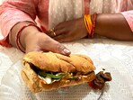 Indian mom eats Subway with achaar. Indian mom eats Subway with achaar.